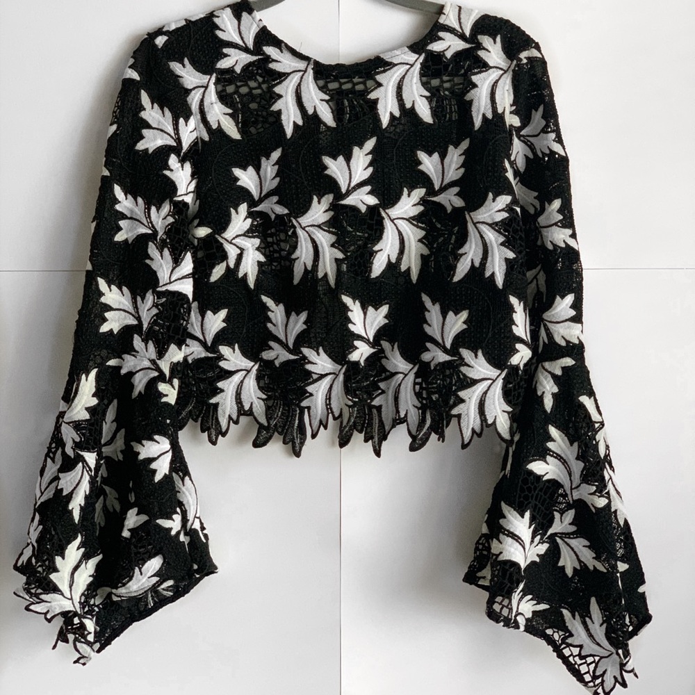 Crochet style black and white bell sleeve crop top